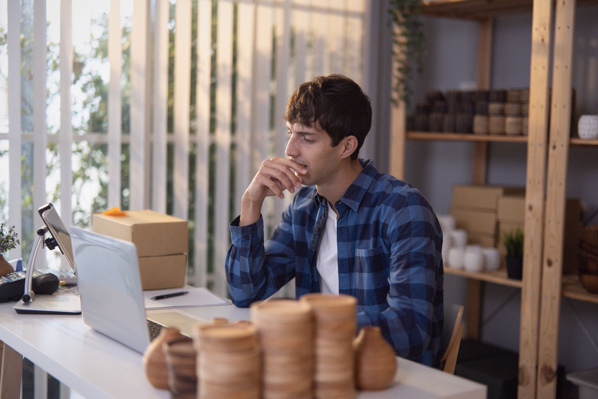 Small business owner at their desk — no marketing team in sight