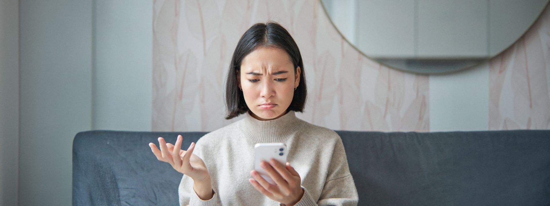 Frustrated person looking at broken website on their phone