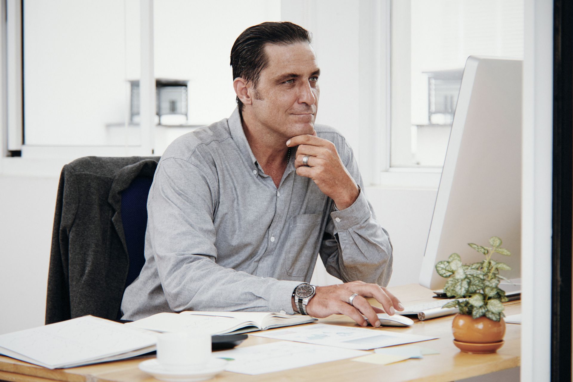 Coach at desk between client sessions — limited writing time